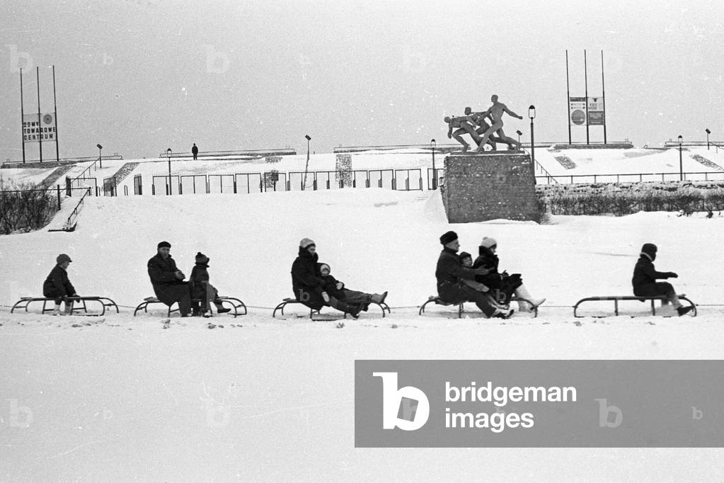Warsaw, 1972. Tractor-pulled sleigh ride infront of 10th Anniversary Stadium. 