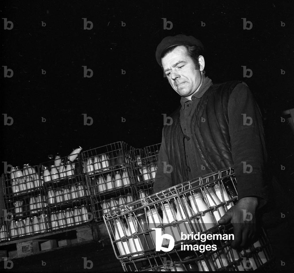 Warsaw, Poland, 01.1973. Milkman delivering milk at 5am. 
