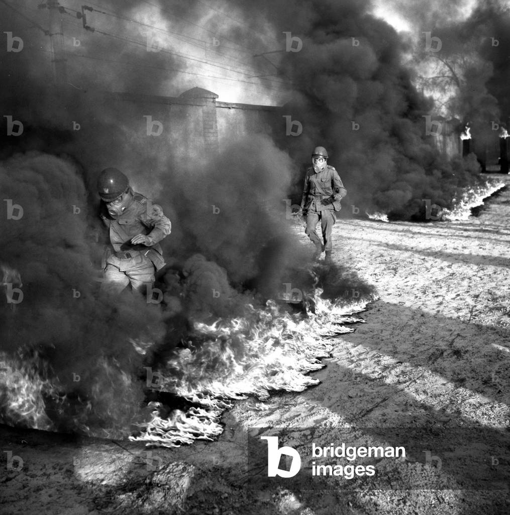 Wroclaw, 1978. Officer School in Wroclaw. Soldiers training in gas masks, fighting a fire. 