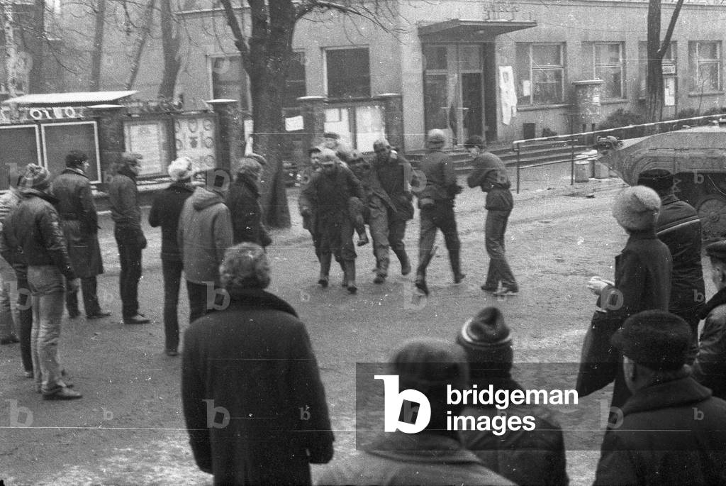 Katowice 16.12.1981. Martial Law in Poland, The pacification of 'Wujek' strike. In picture: a miner hurt during an attack at the mine is removed from the area by his colleagues. 