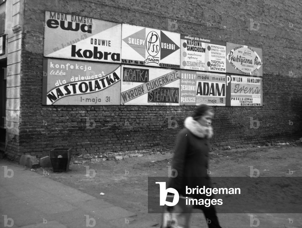 Zyrardow, Poland,18.01.1973. Advertising boards on the wall. 