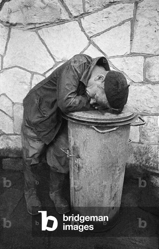 Kazimierz Dolny, Poland, 06.1975. Worker sleeps on a bin. 