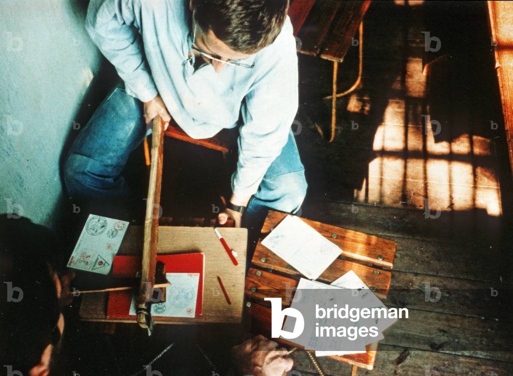 Bialoleka, 07.1982. Internmentees during martial law period in Poland. Zbigniew Sarata of NSZZ Solidarity (Mazowsze region) stamps envelopes with free internment post stamps. 