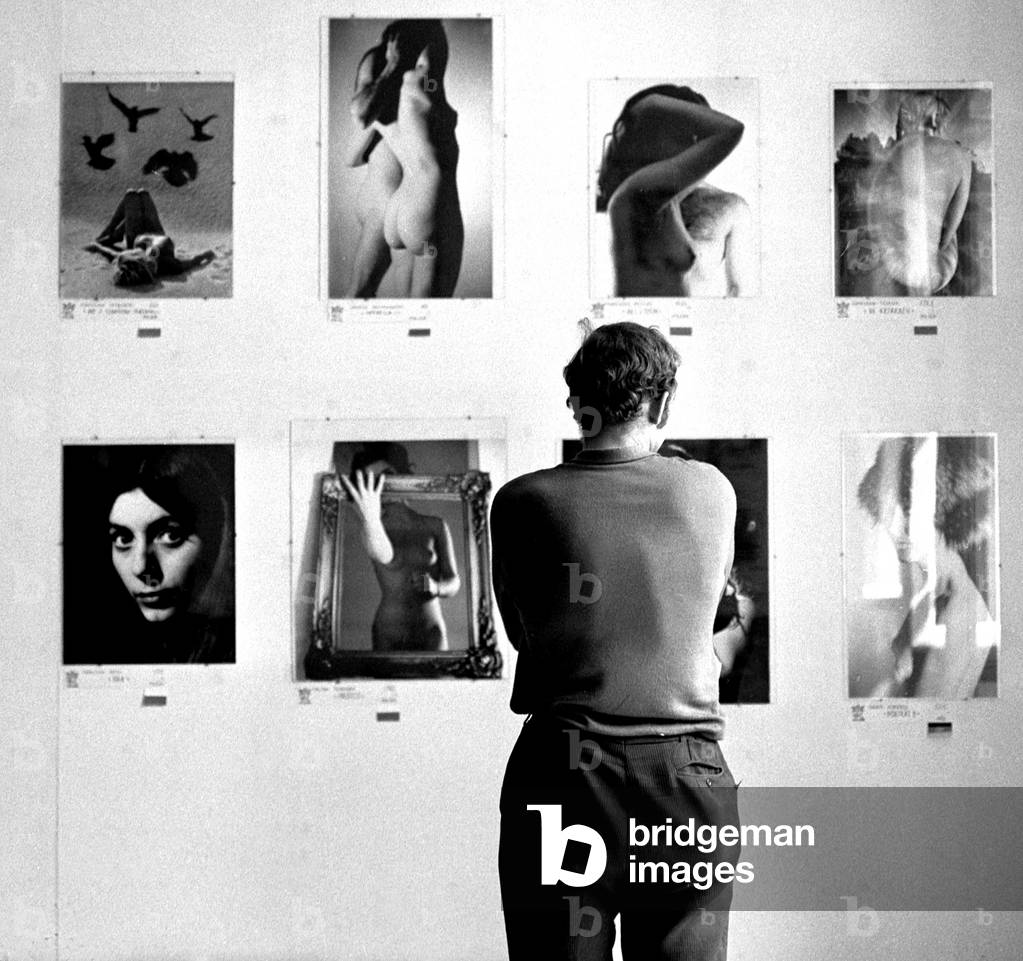 Warsaw, Poland, 1972. Men at the ' Venus' exhibition - photos of naked women. 
