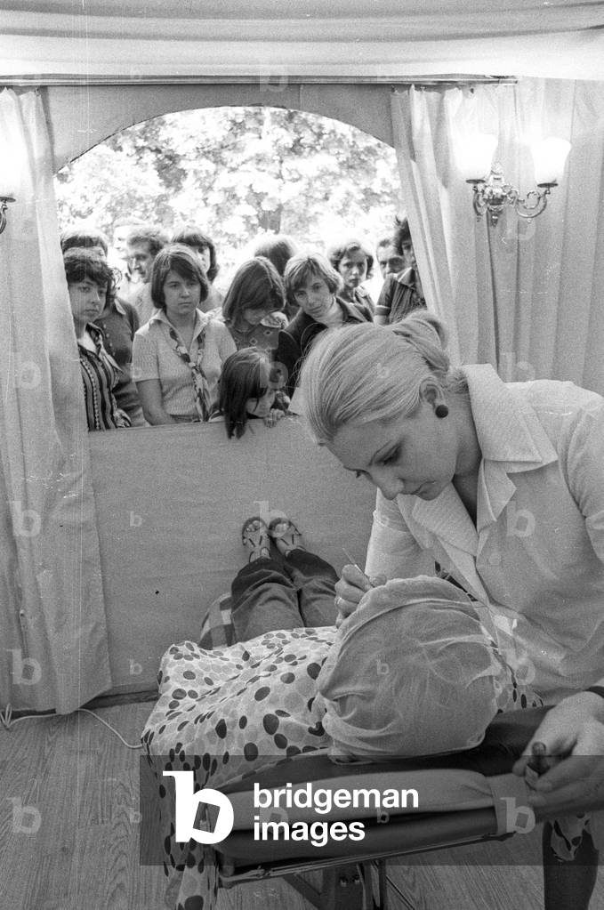 Kampinos, near Warsaw, Poland, 1976. Social free service. Beautician giving a make-up tutorial. 