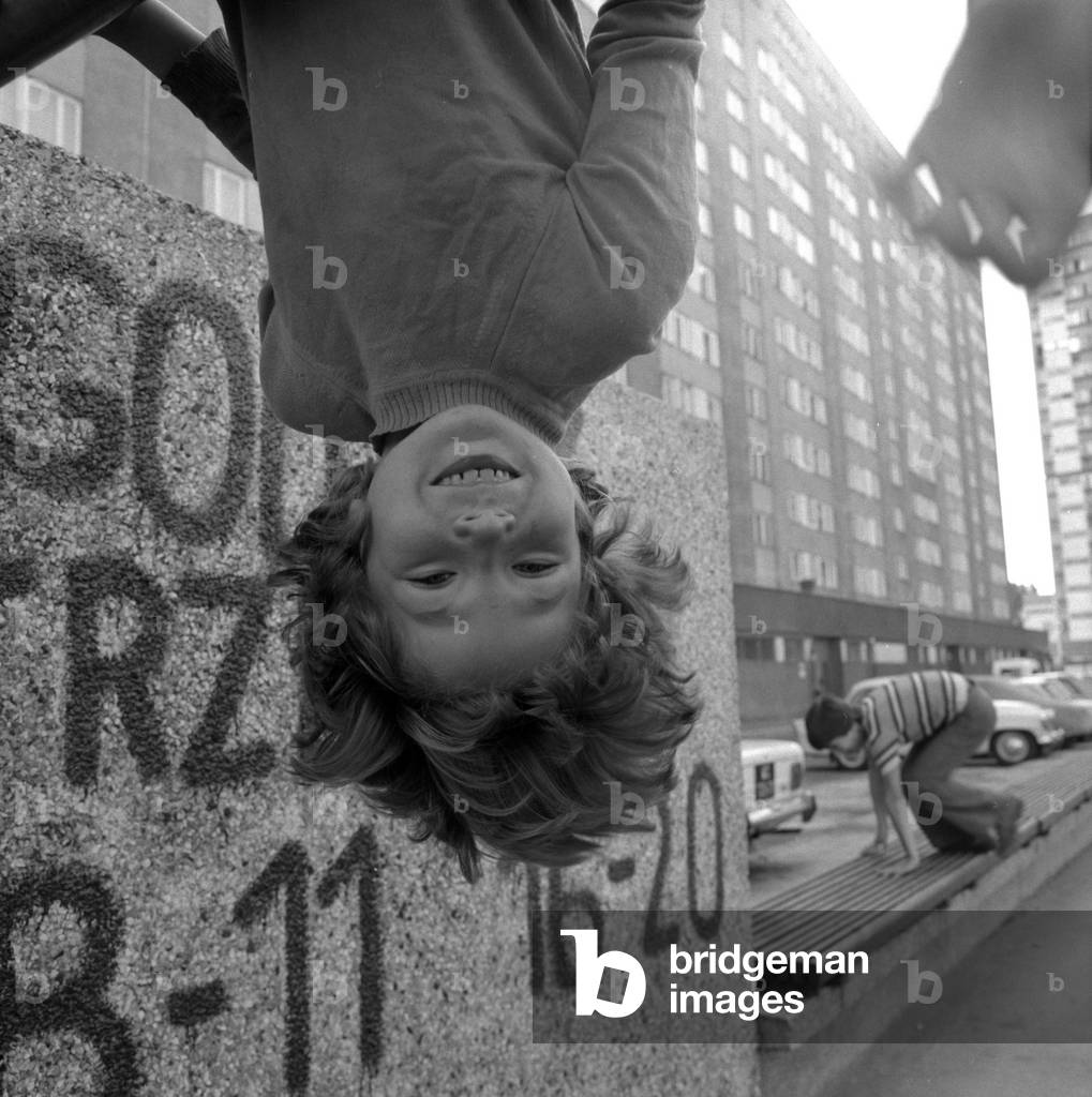 Warsaw, Poland, 1974-1975.Child playing outdoor at the 'Zelazna Brama' housing estate. 