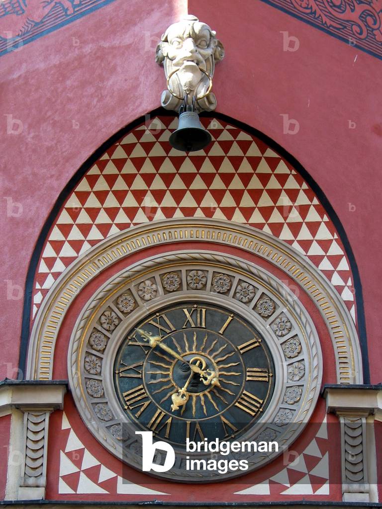 Warsaw, 05.03.2004. Old Town. Clock on one of the buildings. 