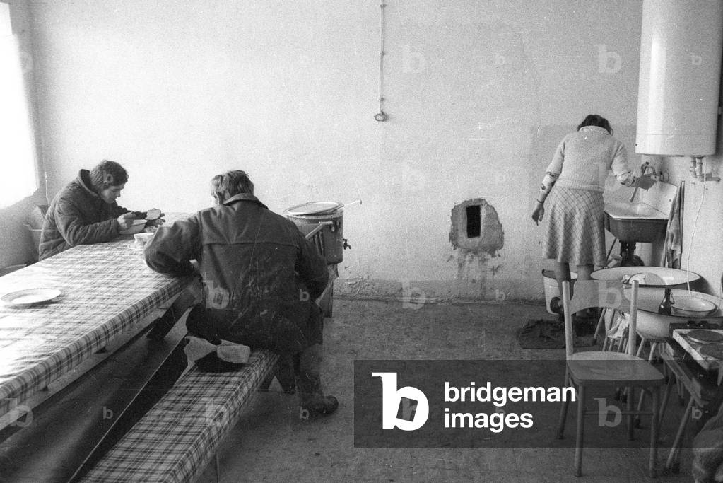 Ursus, Warsaw, Poland, 1978. Men eating soup in a canteen. 