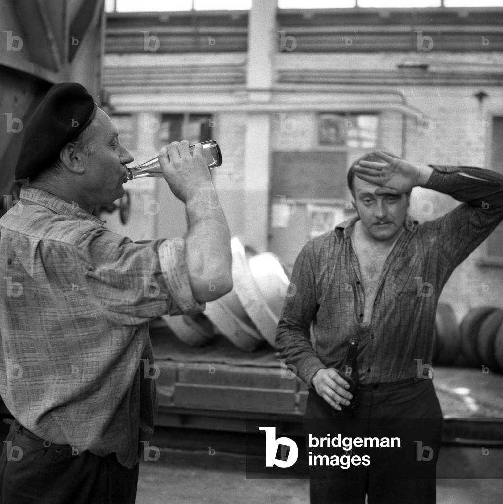 Warsaw, Poland, 1976. ' Ludwik WaryËùski ' Building Plants Factory ( Zaklady Warynskiego). Workers drinking water during a break. 