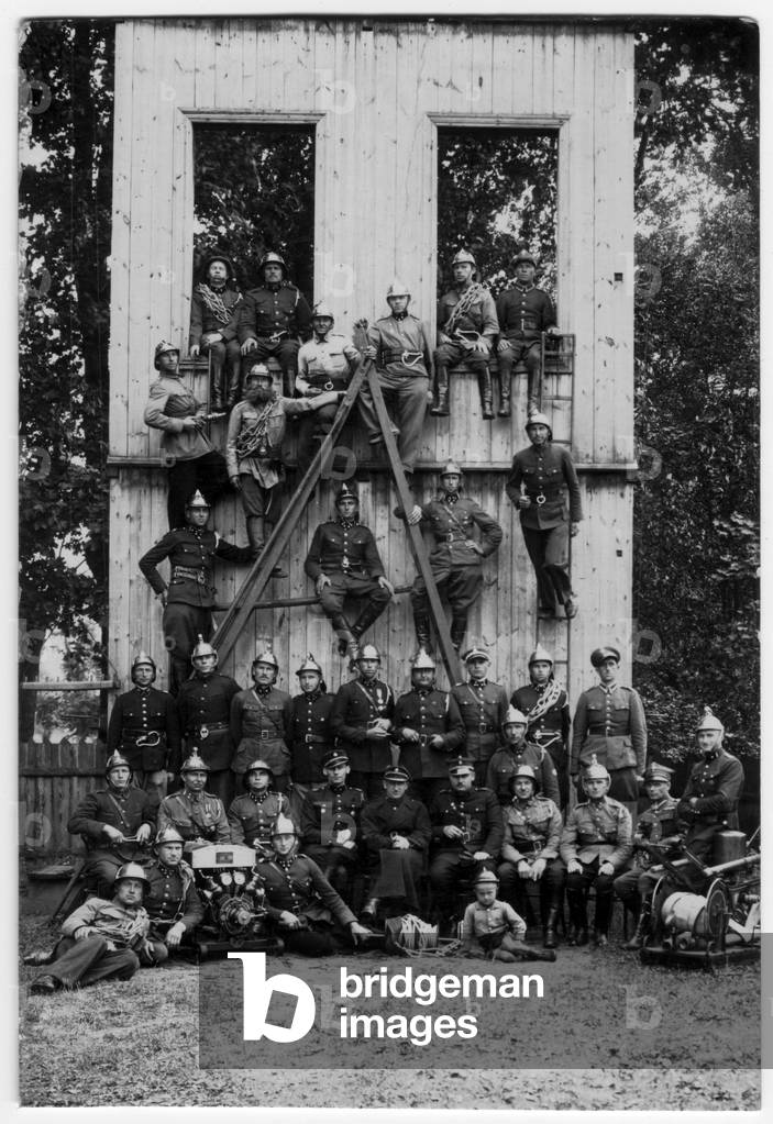 Suwalki, Inter-war period Poland, 1929-1930. Group picture of fire brigade chiefs from Suwalki County taken next to the training wall. Fourth from right is Konstanty Krzywicki. Picture from a private archive of the Krzywiccy family from Krasnopol. Information about picture - Krzywickie sisters. 