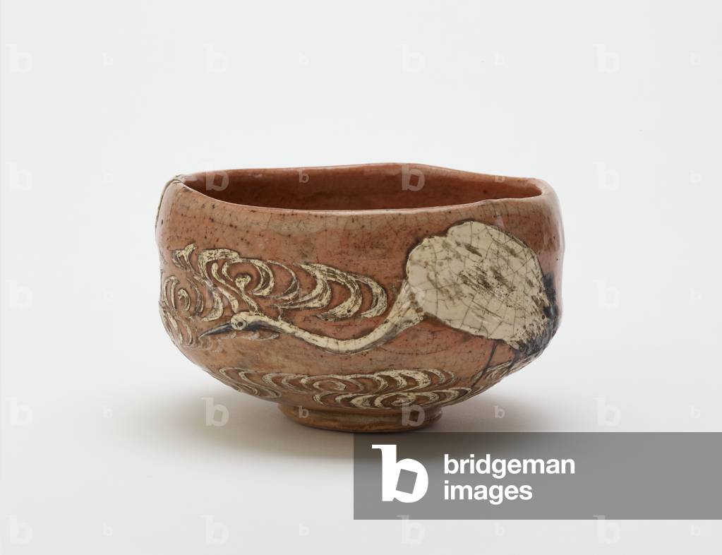 Kenzan style tea bowl with design of crane and flowing water, late 19th century (red clay, white slip, iron pigment under clear lead glaze)