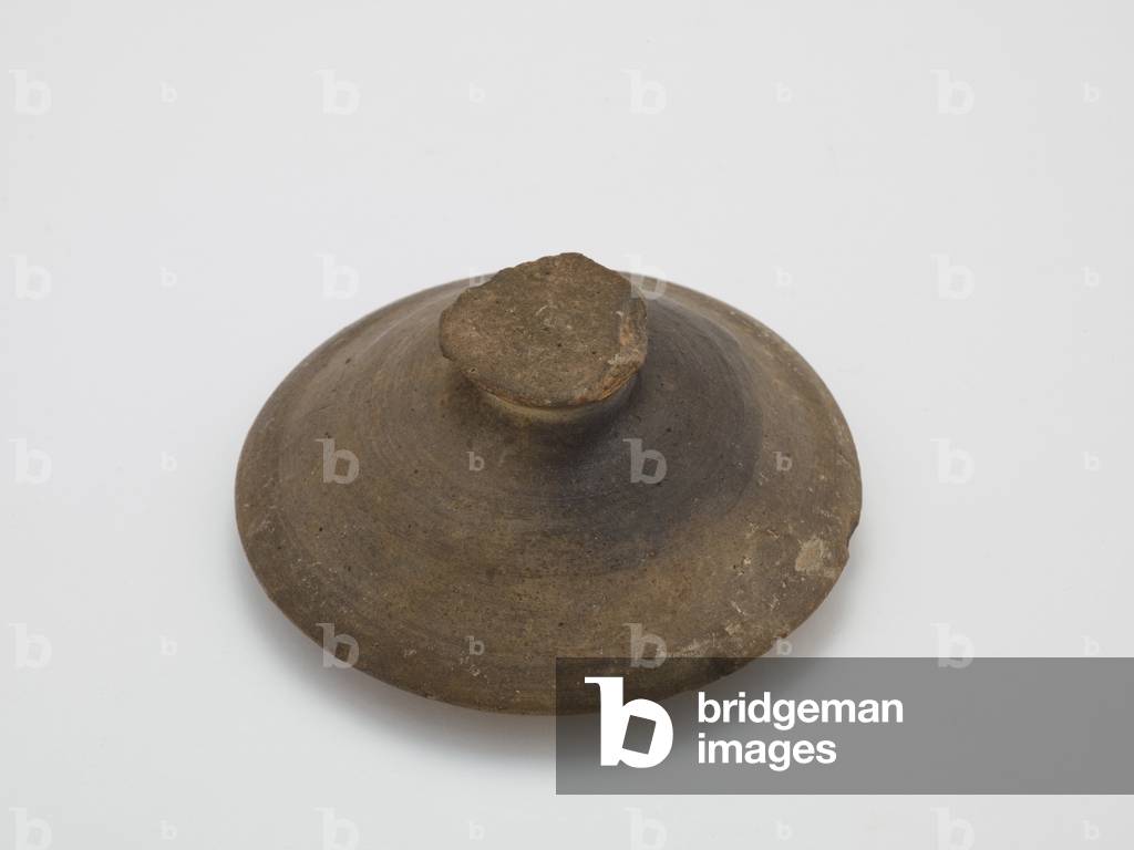 Lid, first half 6th century (unglaze stoneware with traces of natural ash glaze)