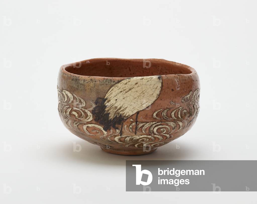 Kenzan style tea bowl with design of crane and flowing water, late 19th century (red clay, white slip, iron pigment under clear lead glaze)