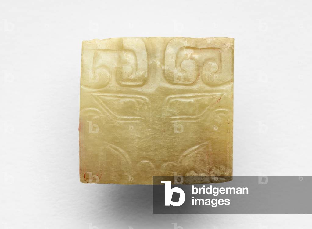 Pendant with mask, probably reworked from a tube (cong 琮), c.1300-c.1050 BC (jade, nephrite)