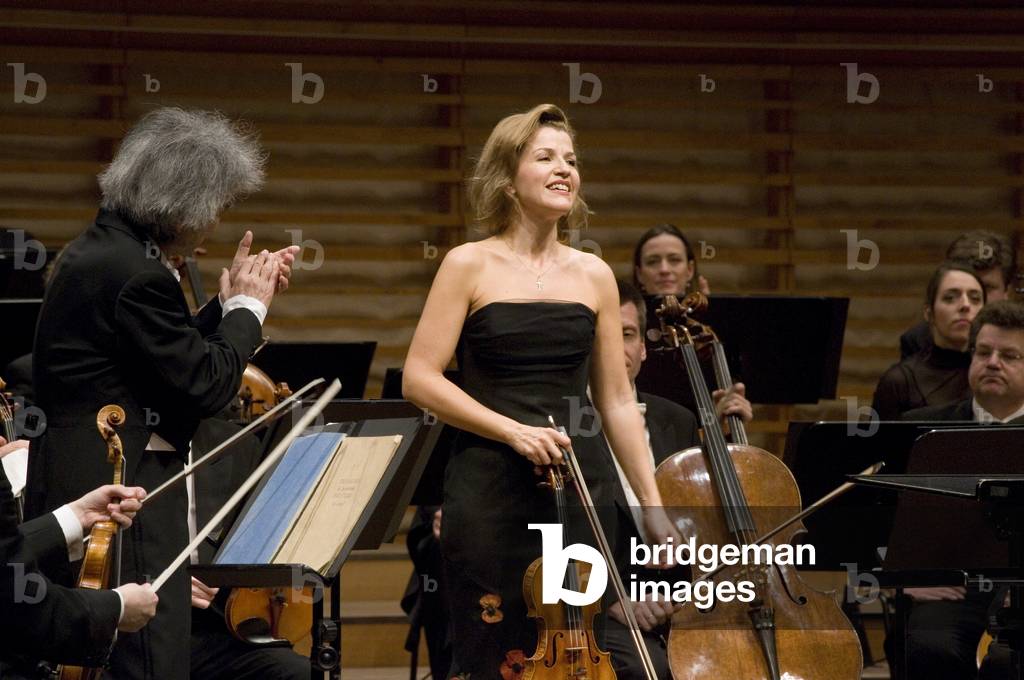 Anne-Sophie Mutter receiving applause after performing  Beethoven Violin Concerto in D-Major Opus 61 with the Berlin Philharmonic Orchestra under  Seiji Ozawa