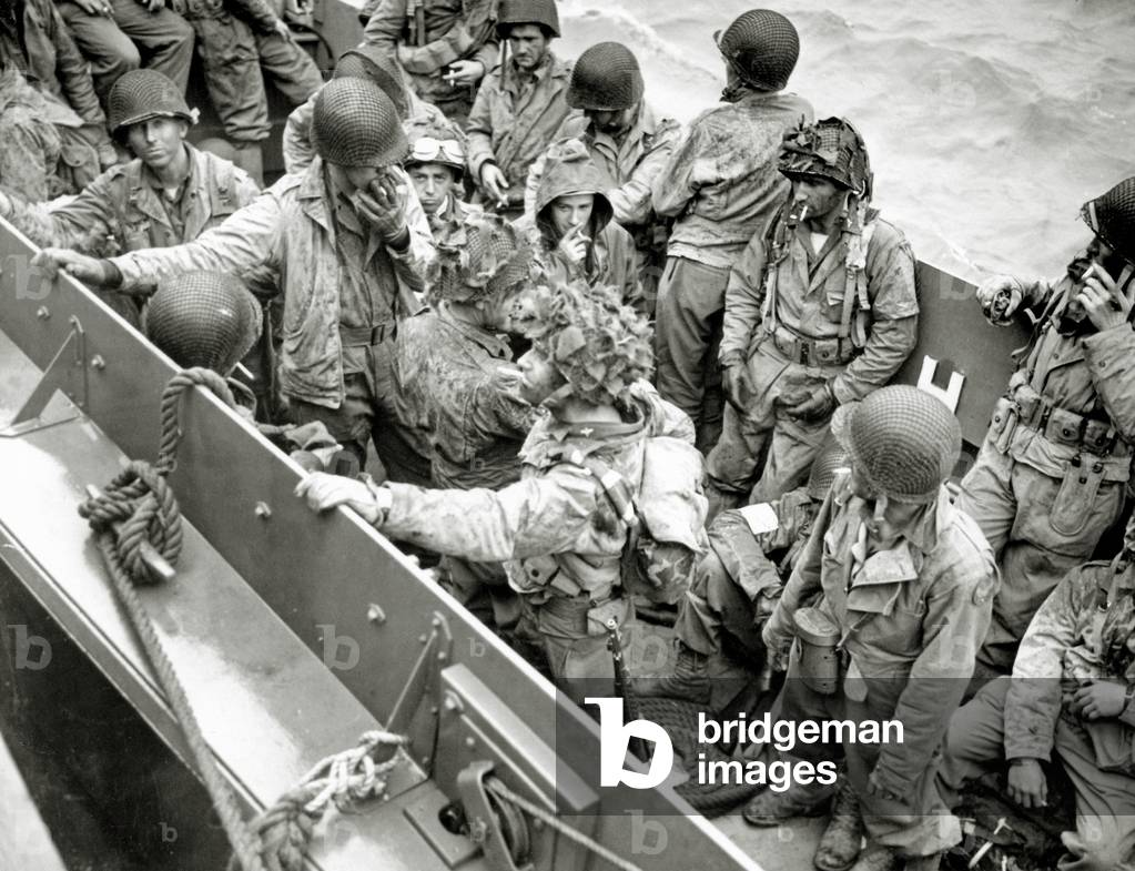 A group of glider pilots is returning to England in a Landing Craft, Vehicle, Personnel (LCVP), English Channel, 8th June 1944 (b/w photo)