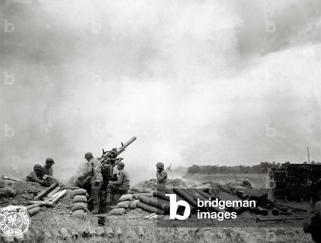 A battery of 90mm M1 heavy anti-aircraft guns in action, Omaha Beach, Normandy, France, June 1944 (b/w photo)