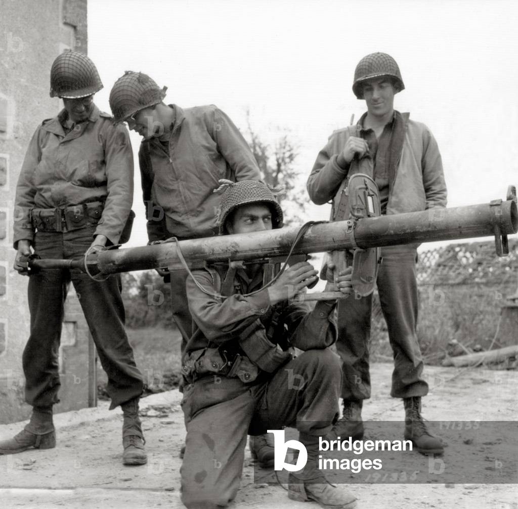 Four GIs with a German Raketen Panzerbüchse 43 Panzerschreck (tank terror) taken from the enemy, Normandy, France, 1944 (b/w photo)