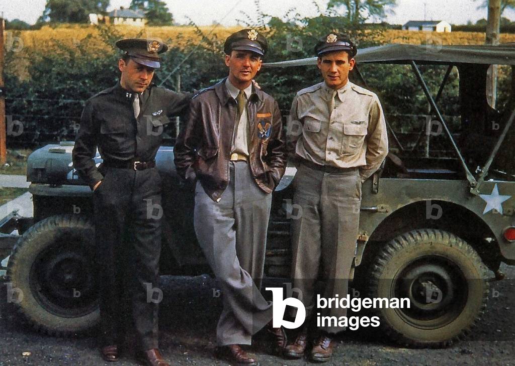 Three pilots of the 332nd Bomb Group, U.S. Army 9th Air Force, posing in front of a Jeep in the Braintree district of Essex, England, 1944 (photo)