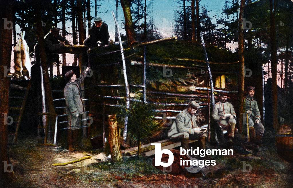 Six German soldiers in a makeshift hut in the forest, France, 1915 (colour litho)