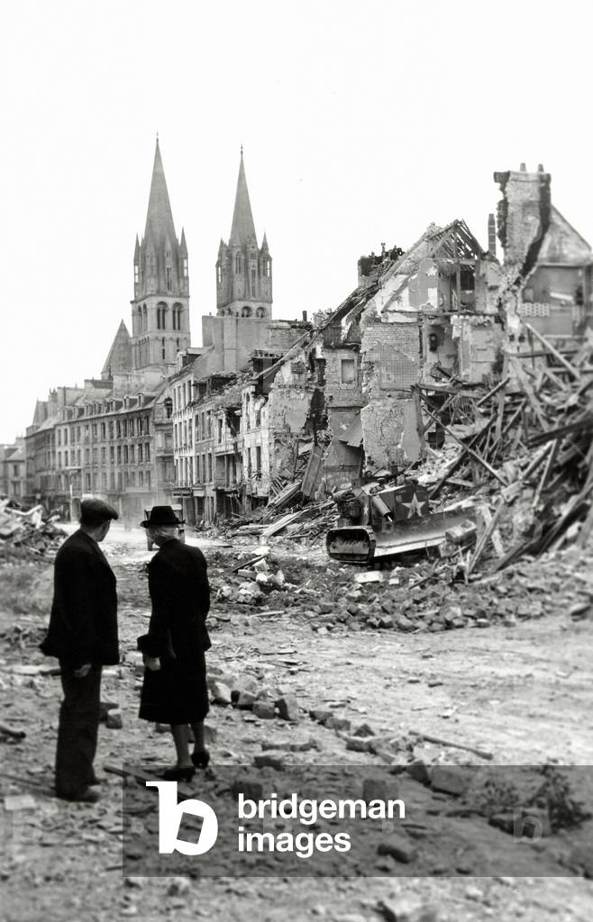 An older couple is watching a Canadian soldier with a bulldozer working in the ruins of a house in the rue de Bayeux, Caen, Normandy, France, 10th July 1944 (b/w photo)