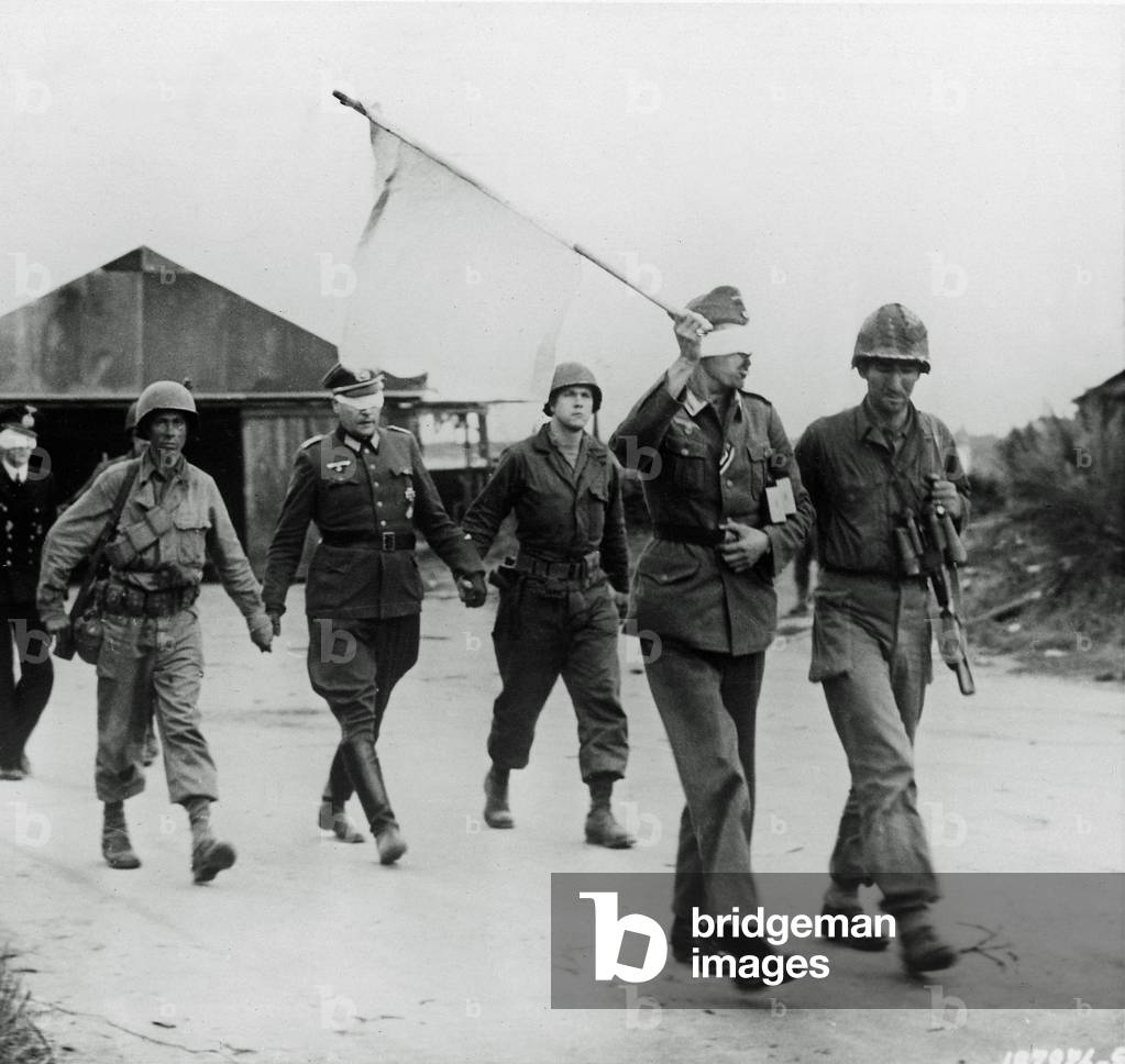 Three German officers have been taken prisoner and are being led back after talks with American officers near Brest, Brittany, France, 20th September 1944 (b/w photo)