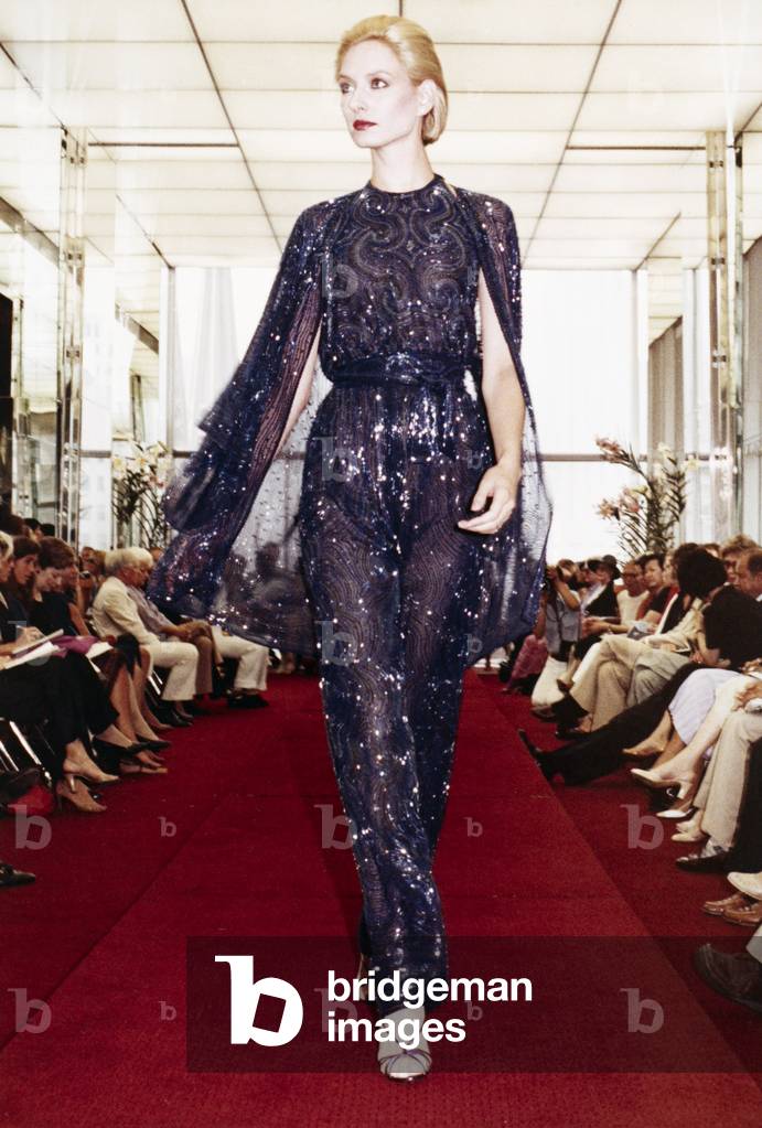 WOMEN'S FASHION, 1980 A model wearing styles from the Halston resort wear collection at a fashion show in New York City, 1980.
