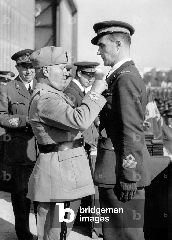 Mussolini decorating an officer, 1943