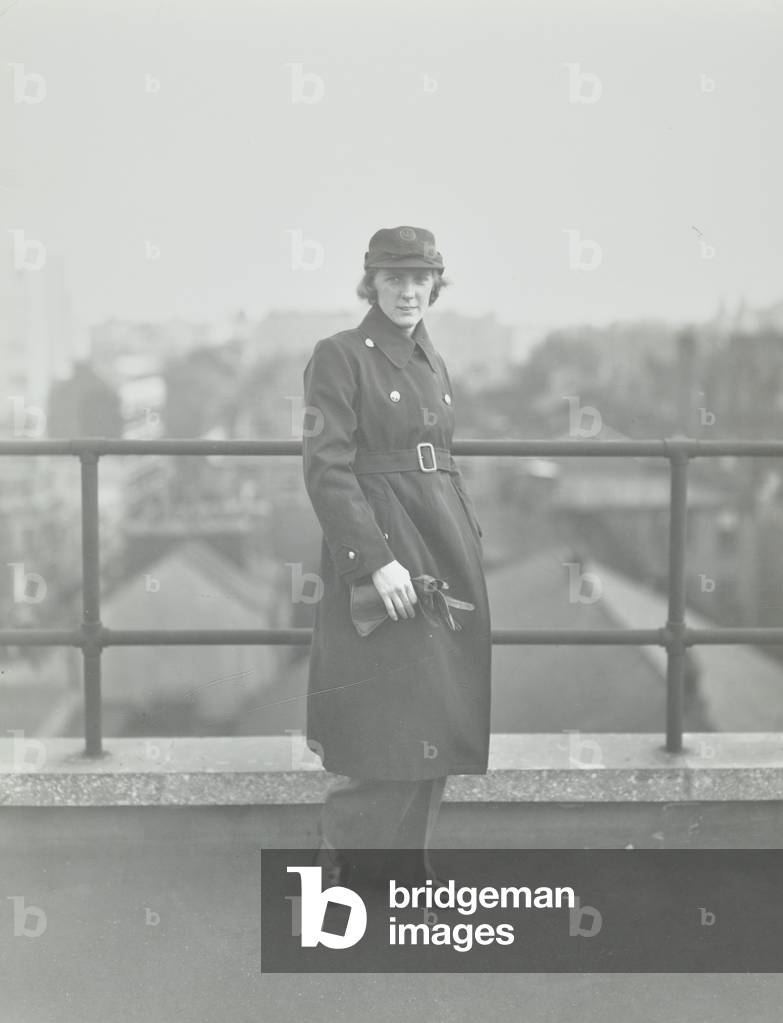 London Ambulance Service: woman wearing A.R.P. uniform, 1938 (b/w photo)