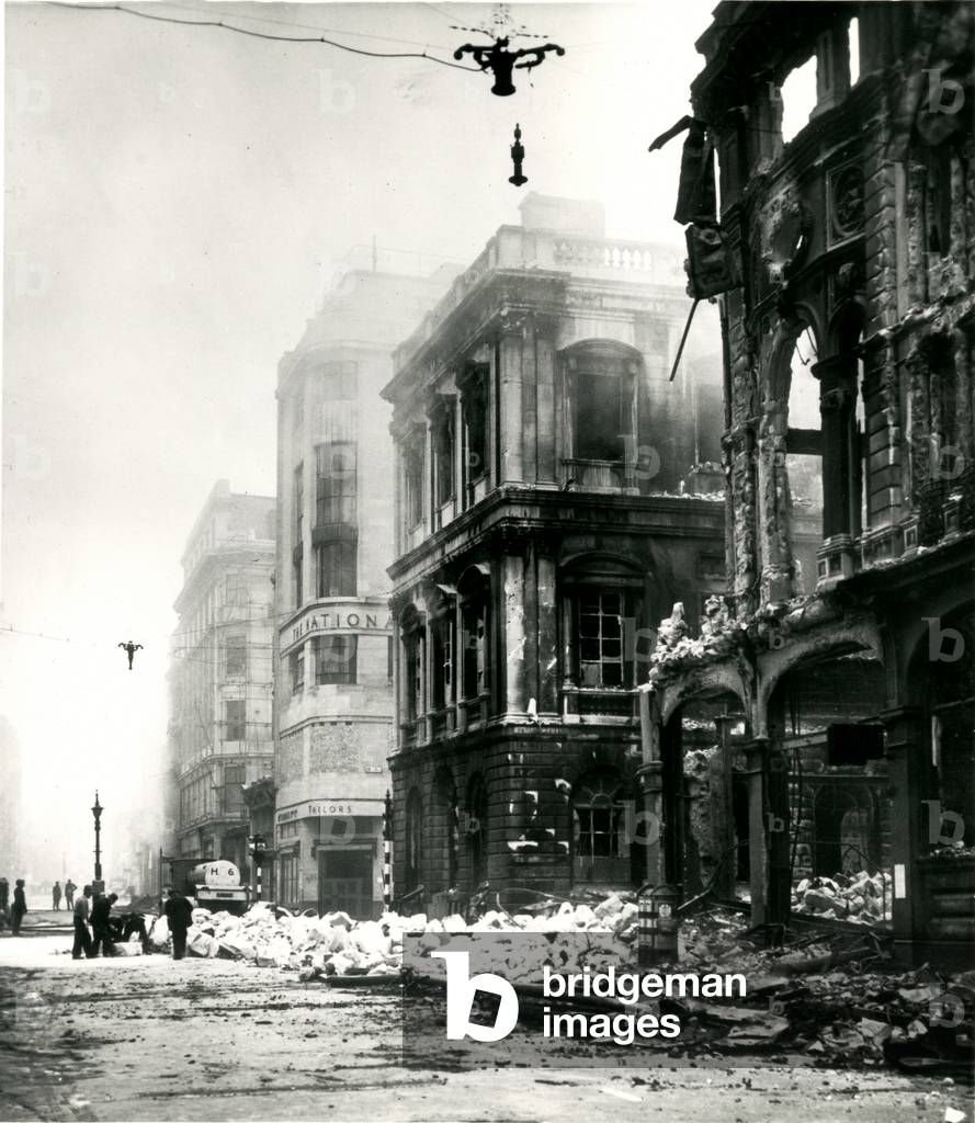 View of buildings in Cheapside showing bomb damage, 1941 (b/w photo)