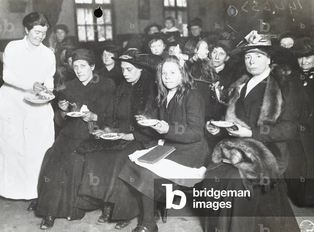 St Augustine's Hall, Victoria Park: a lesson on how to live on voluntary rations, 1914 (b/w photo)