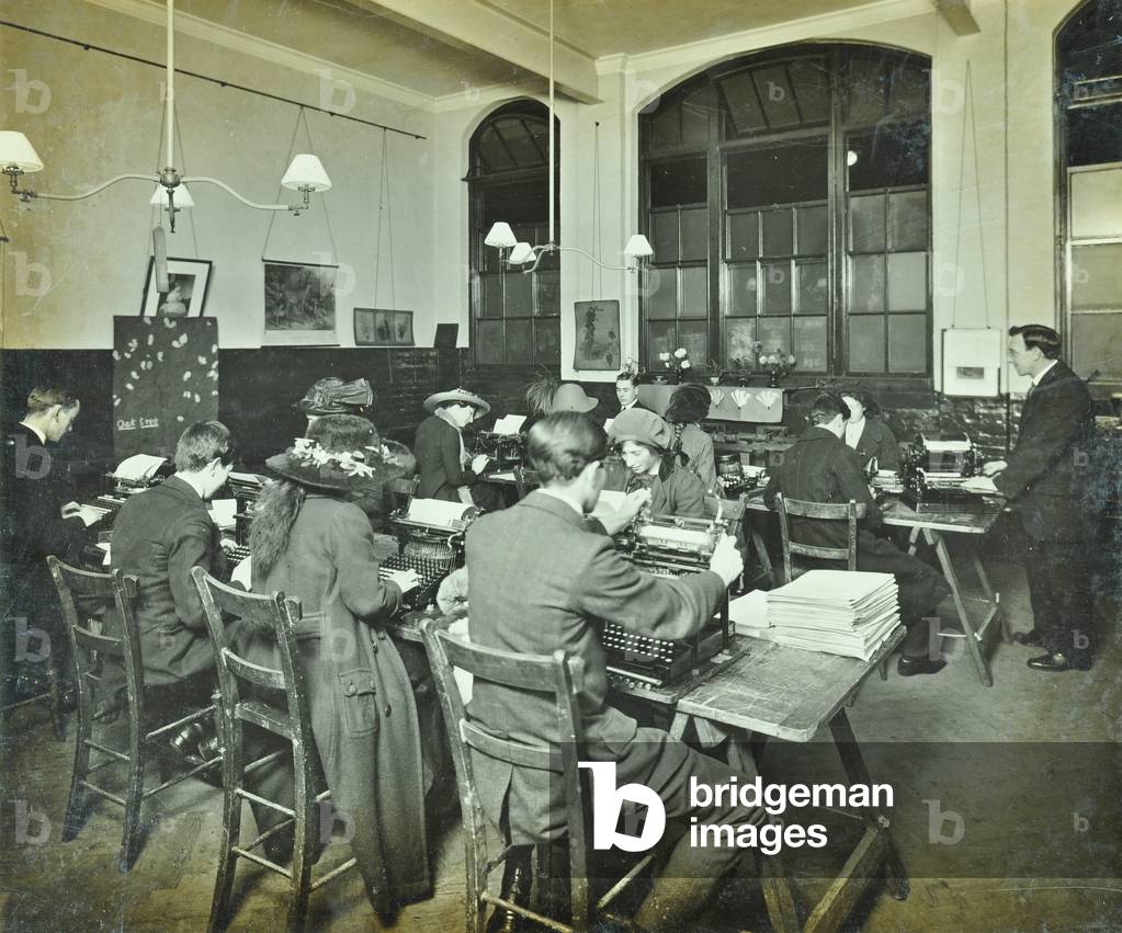 Classroom of William Street School, Hammersmith with men and women at their desks, London, 1913 (b/w photo)