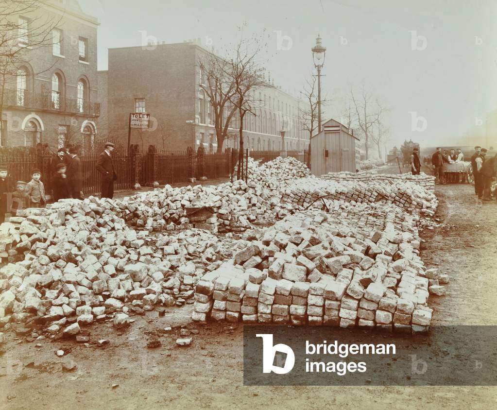 Coborn Road: building materials deposited by Stepney Borough Council, 1907 (b/w photo)