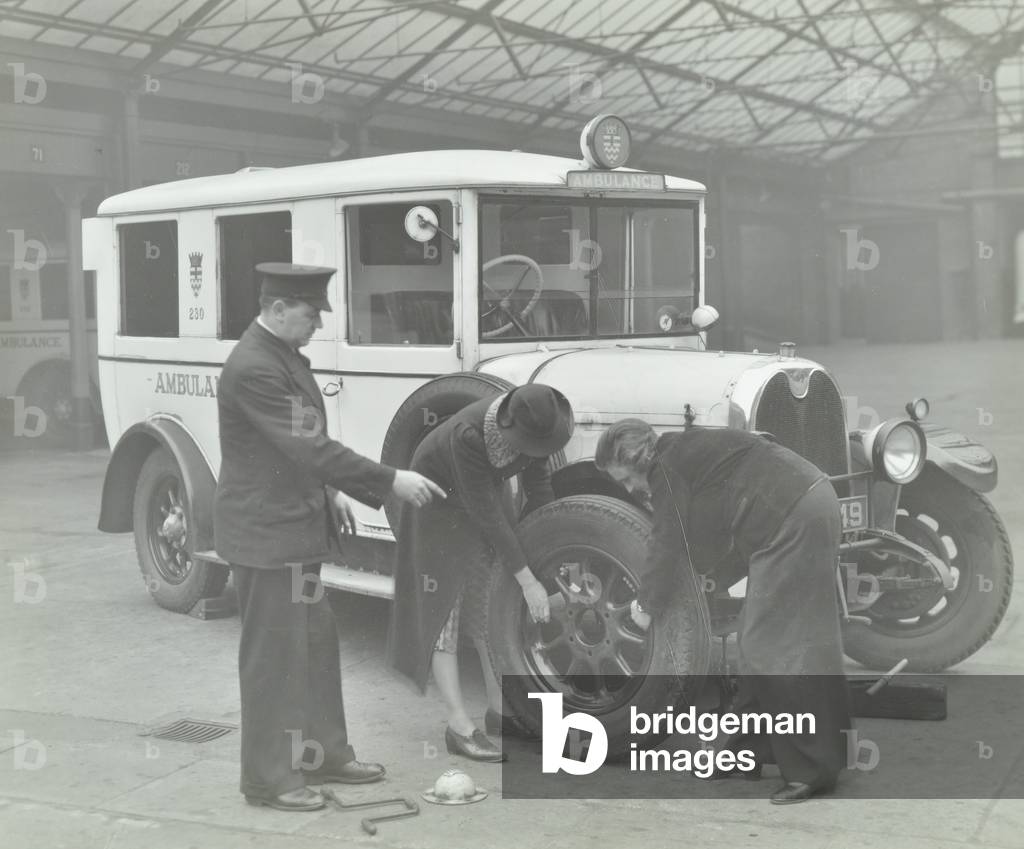 Volunteers being instructed at North Western Ambulance Station, 1939 (b/w photo)
