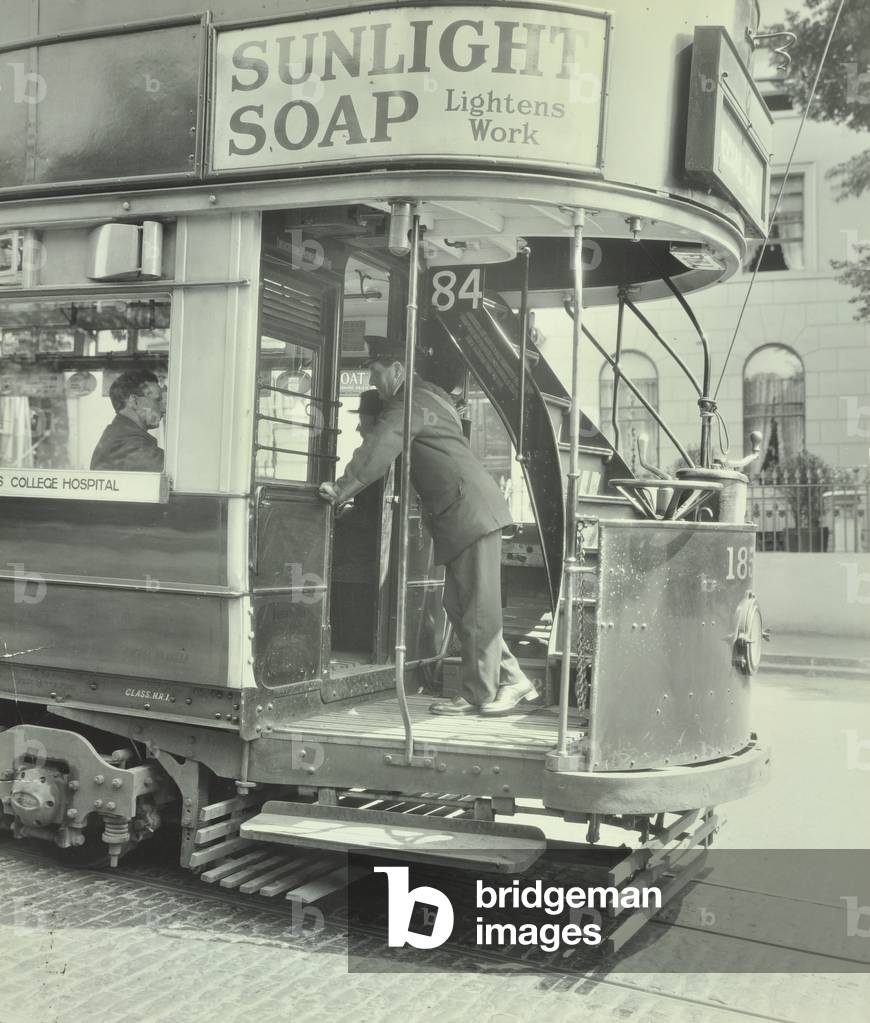 Conductor at saloon door, 1929 (b/w photo)