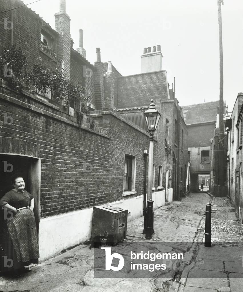 Layton Grove: woman in alleyway, 1923 (b/w photo)