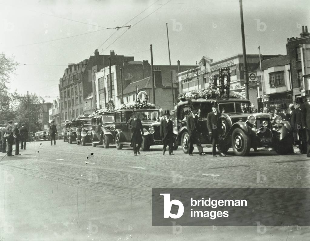 Funeral procession in Bow Road, London, 1932 (b/w photo)