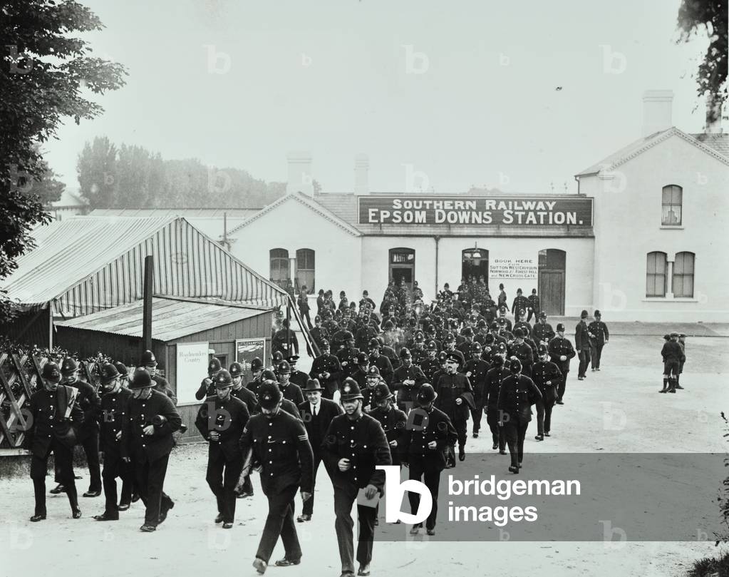 Policemen arriving for duty outside Epsom Downs Station on Derby Day, 1924 (b/w photo)
