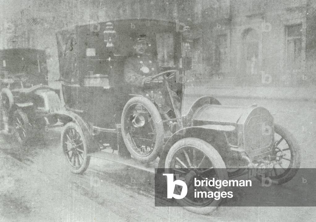 Cabman driving a taxi, 1909 (b/w photo)