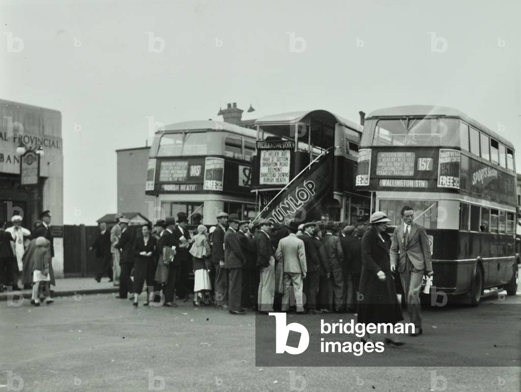 Buses and bus queue, 1933 (b/w photo)