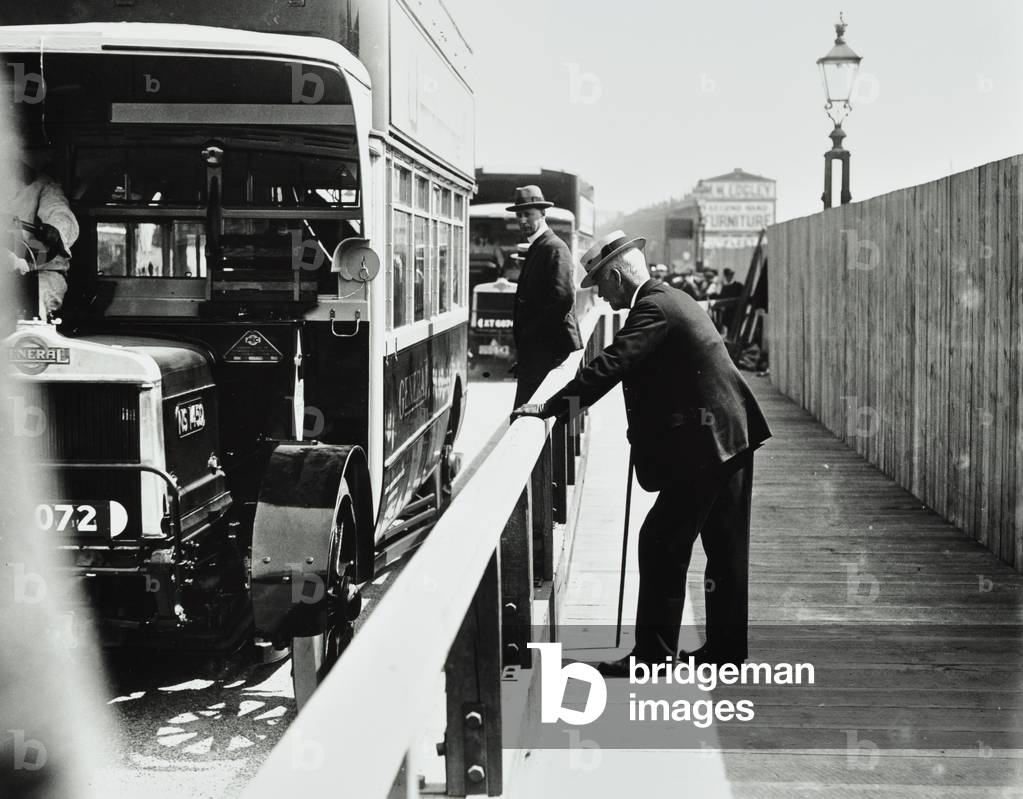 Waterloo Bridge: motorised vehicles and a pedestrian on the bridge, 1924 (b/w photo)