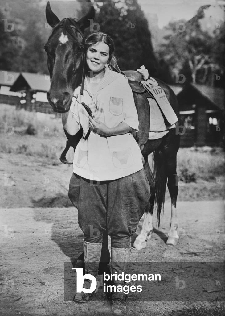 Female Postal Worker with Horse during World War I, Los Angeles, California, USA, Bain News Service, 1917 (b/w photo)