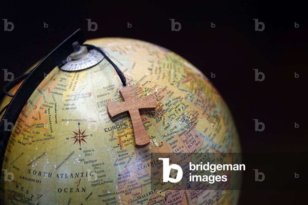 Coronavirus (COVID-19) epidemic, World globe wirth Christian cross (photo)