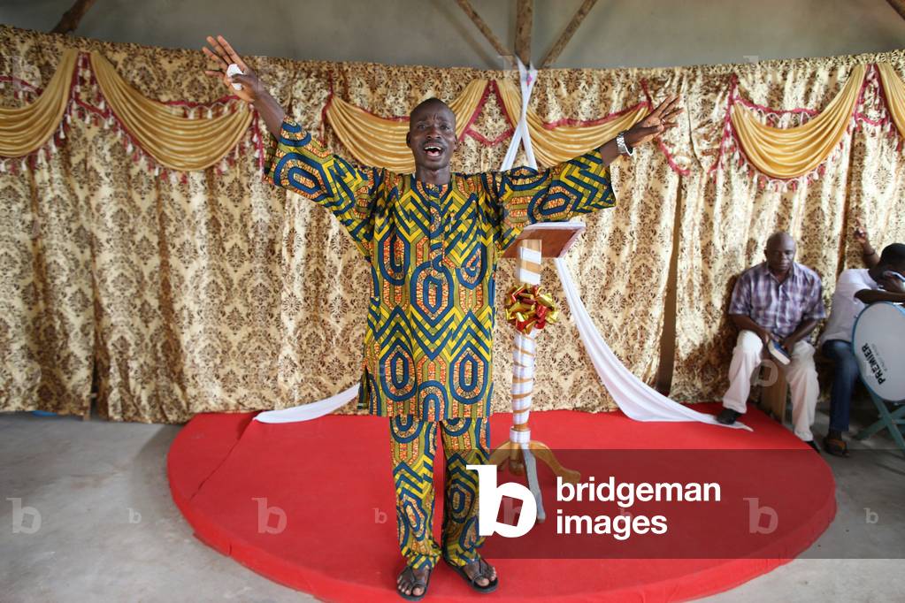 Evangelical preacher in church, Lome, Togo