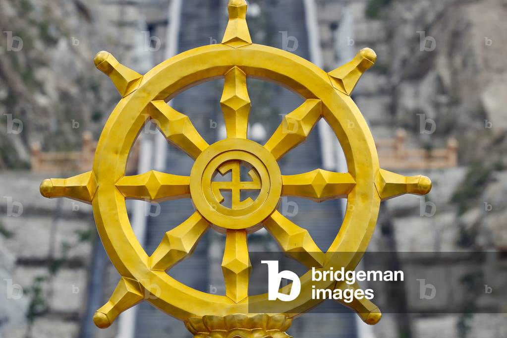 Ong Nui buddhist pagoda, The dharma wheel, or dharmachakra in Sanskrit, is one of the oldest symbols of Buddhism, Quy Nhon, Vietnam, 2019 (photo)