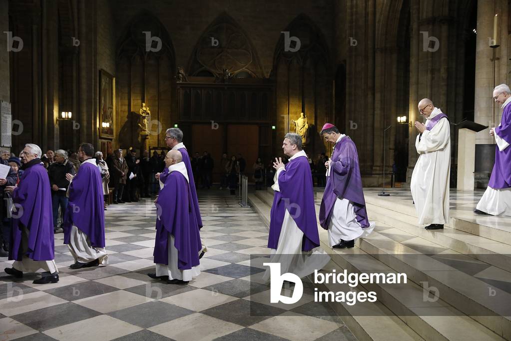 Ash wednesday celebration at Notre Dame cathedral, Paris, France, Exit procession. (photo)