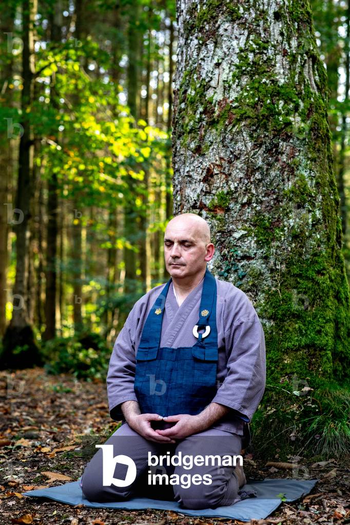 Zen sesshin (retreat) at La Trappe abbey, Soligny-la-Trappe, France.     Zazen (meditation) in a forest. (photo)
