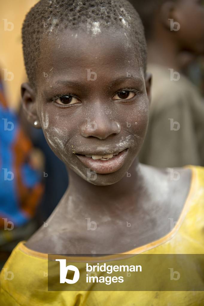 Teenager at a voodoo funeral near Kara, Togo.