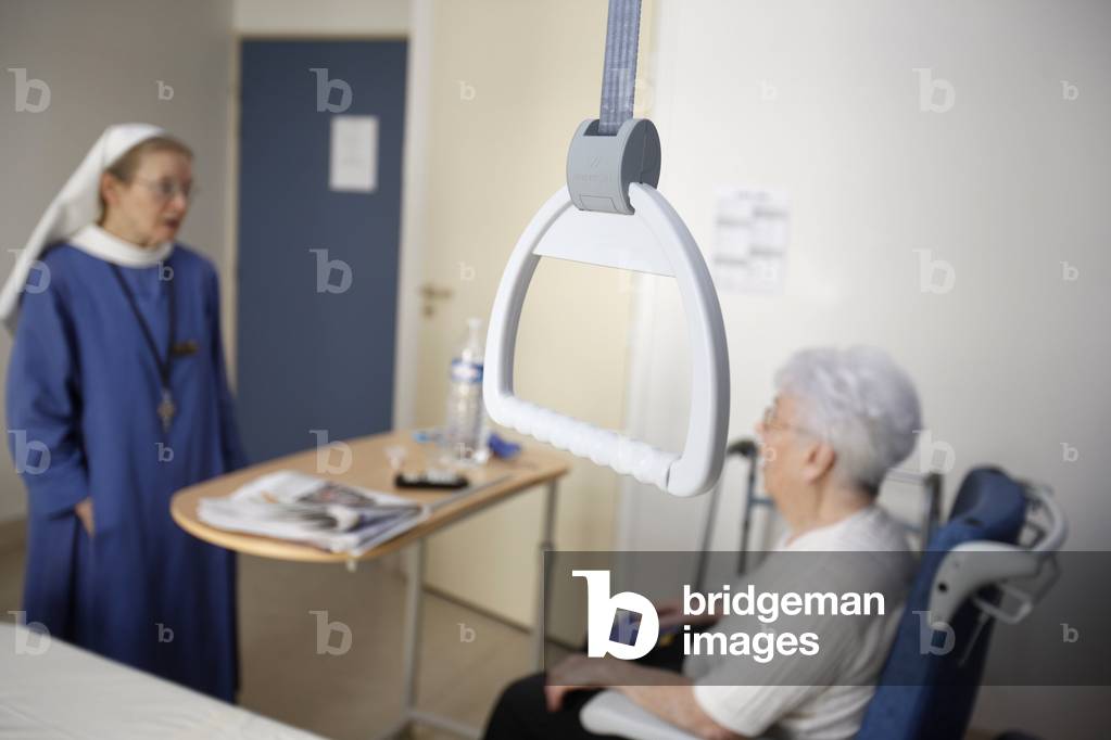 Protestant nun with an elderly hospital patient , Courbevoie, France