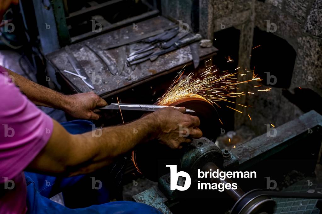 Knife maker XHEMAJILI HOTI, at work in Prizren, Kosovo, received loans from AFK microfinance (photo)